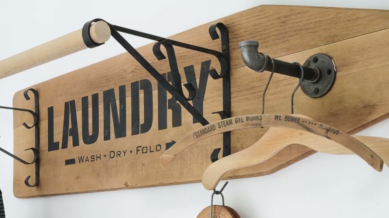 DIY laundry room drying rack with a vintage ironing board!