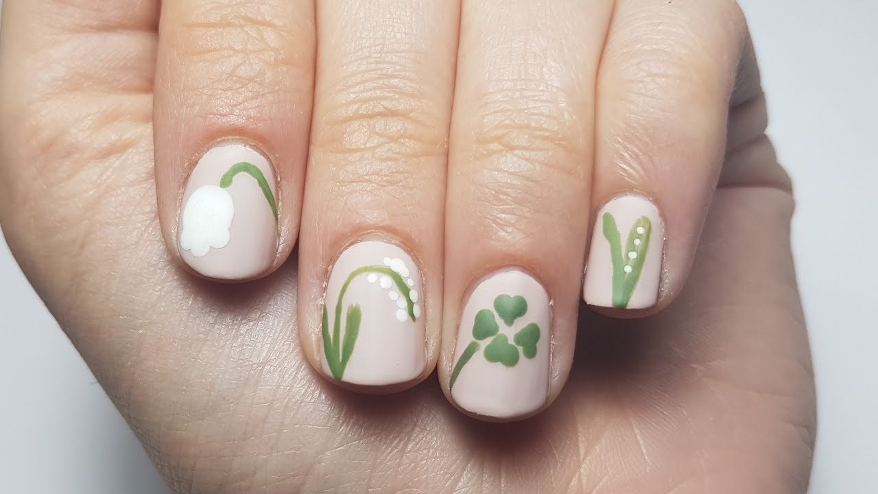 Nail art 1er mai avec muguet et trèfle