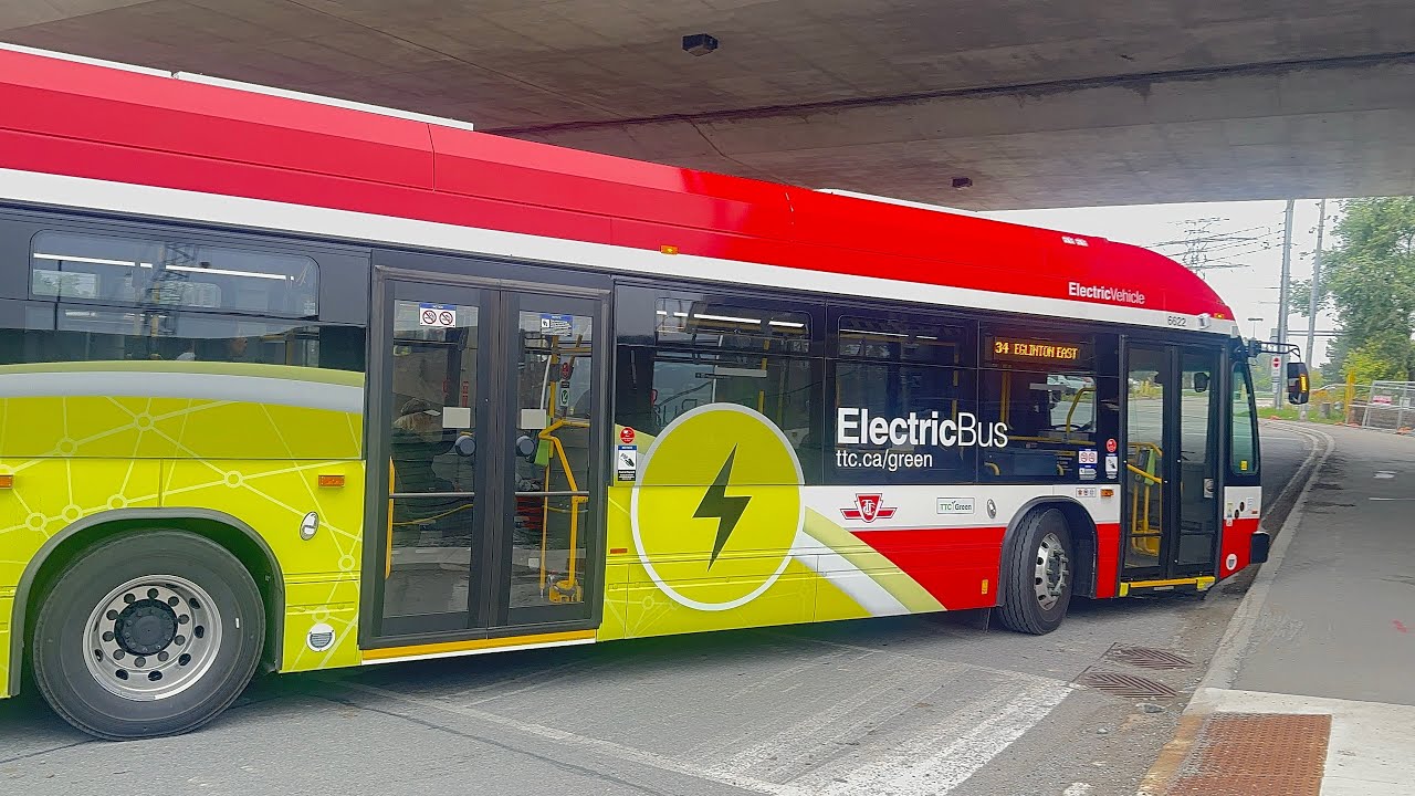 TTC buses at Kennedy station and 2 go trains 