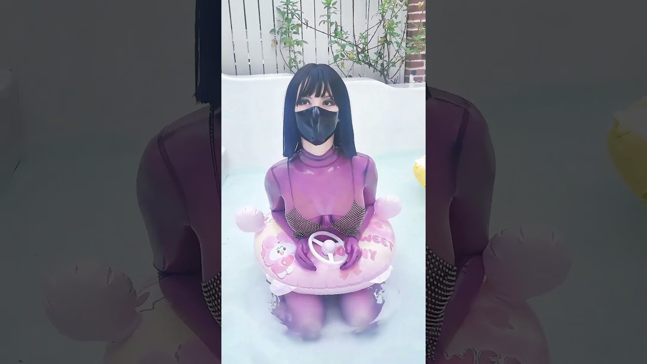 💦 Sheer pink catsuit + pool float = pure cuteness overload! 😍 #latex