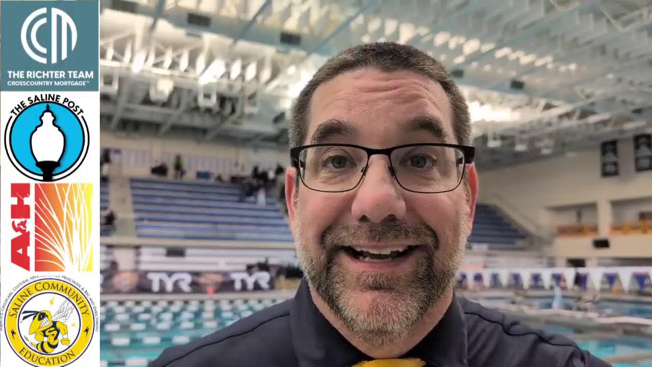 talking with Saline swim and dive coach Jason Black.
