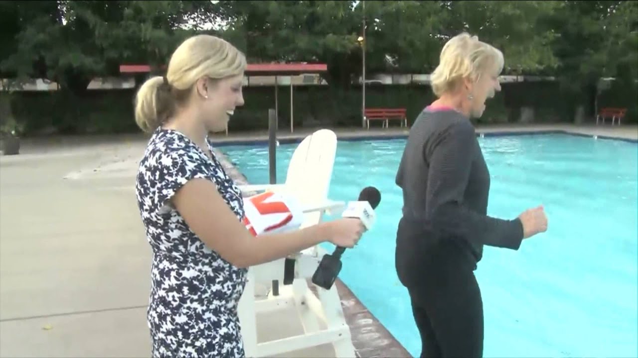 Photographer Shoves Reporter into Swimming Pool 