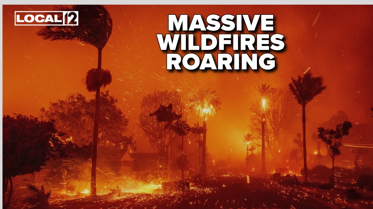Wildfires burn out of control across Los Angeles area, thousands flee homes