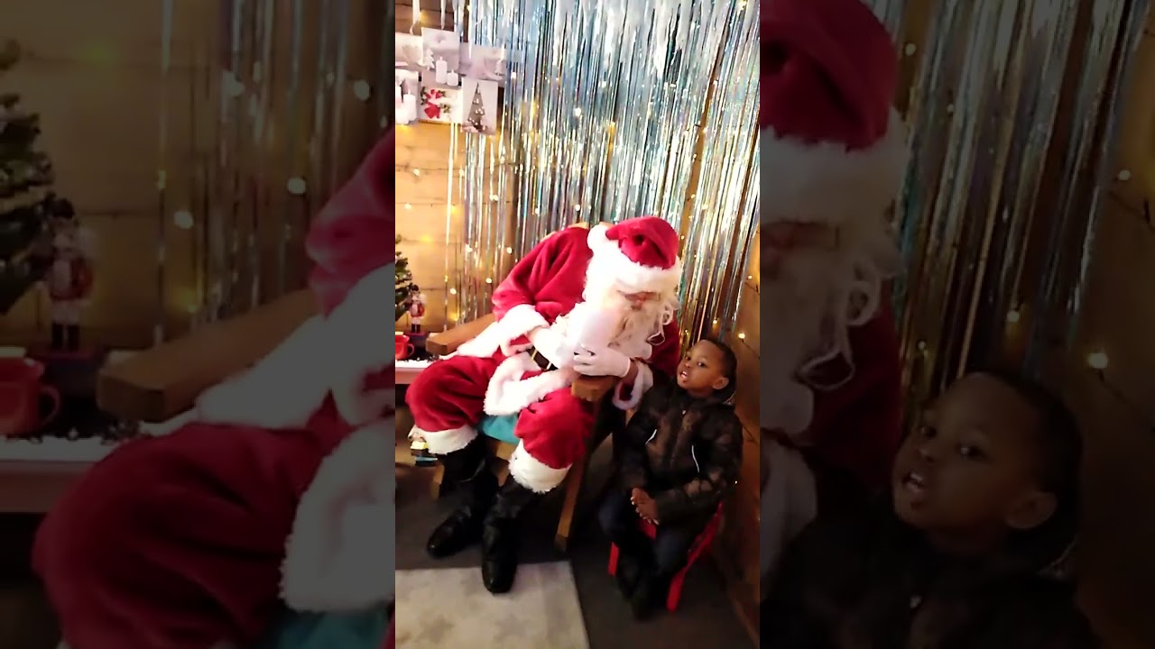 Ernest and sisters meeting santa for the ist time in UK.