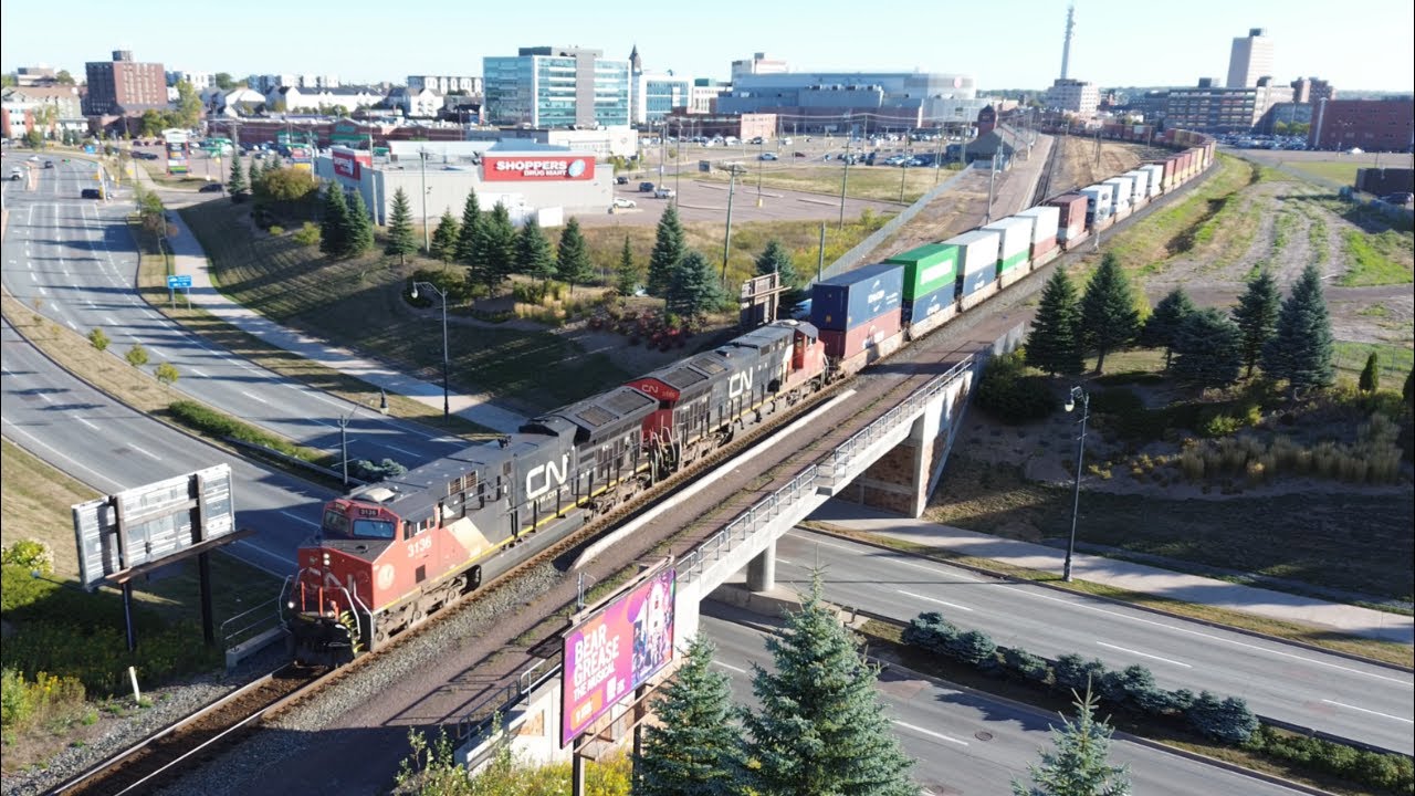Awesome Aerial 4K View! Long Extra Stack Train CN X121 passing thru Downtown Moncton, NB