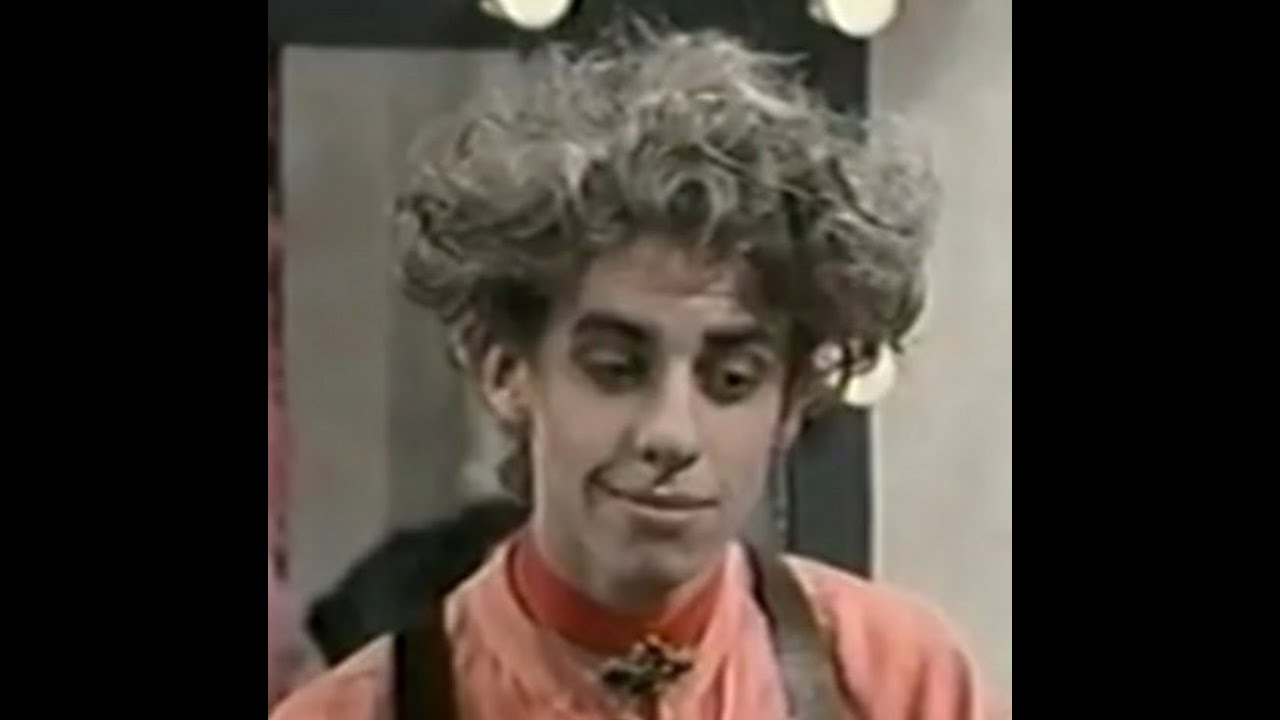 Christian Borle as a hairdresser in 1994