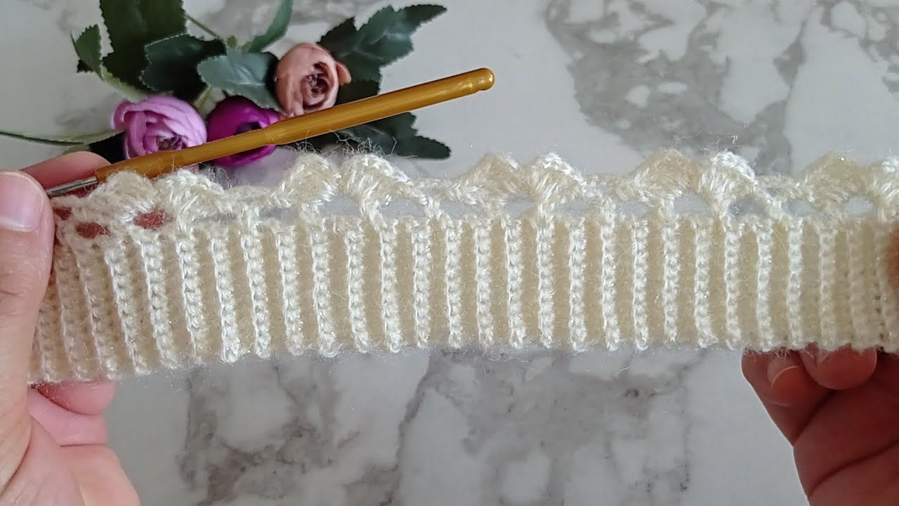 Bu model gerçekten zarif ve şık bir örnek — ajurlu ve tığ işi bir dokuya sahip. Yelek yapmak için