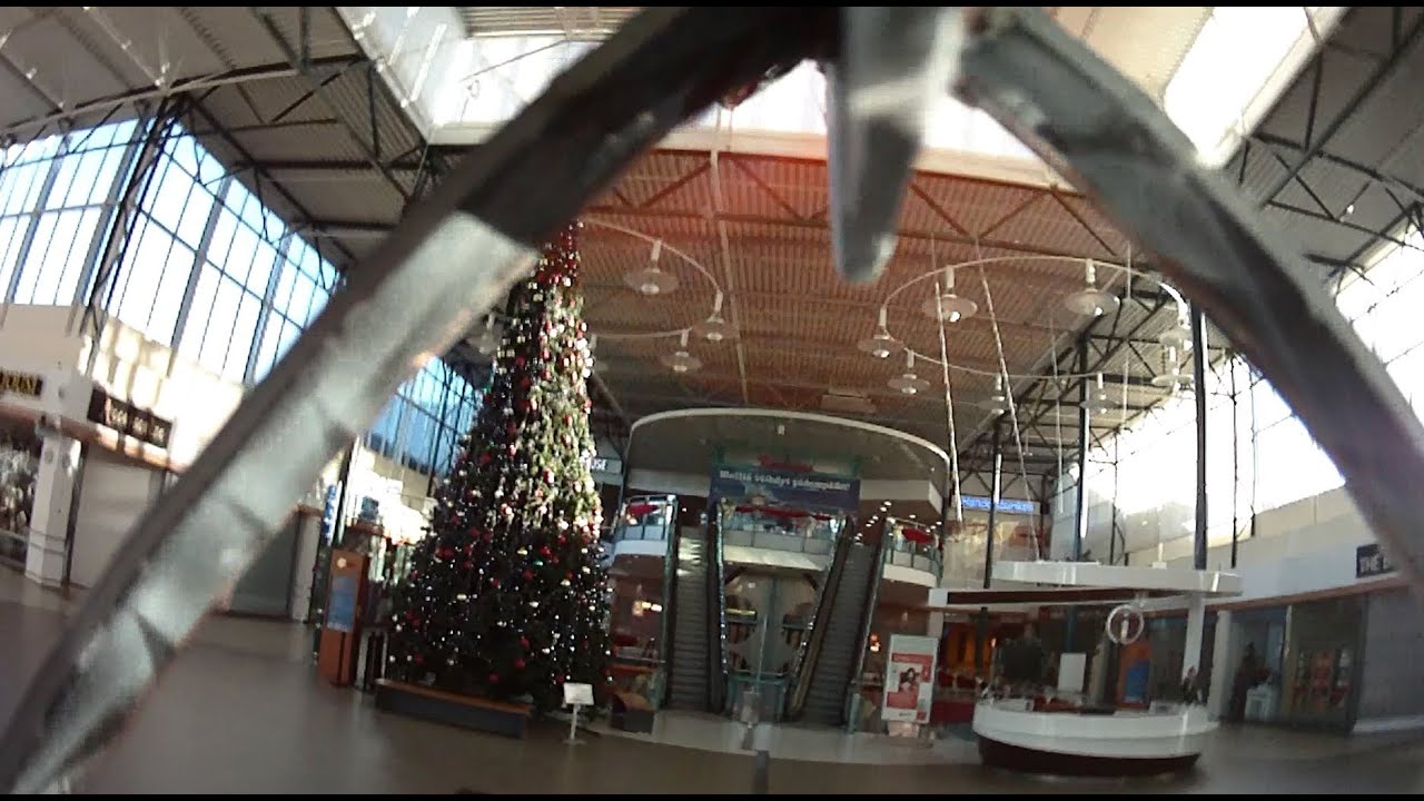 Plane flying inside shopping center!