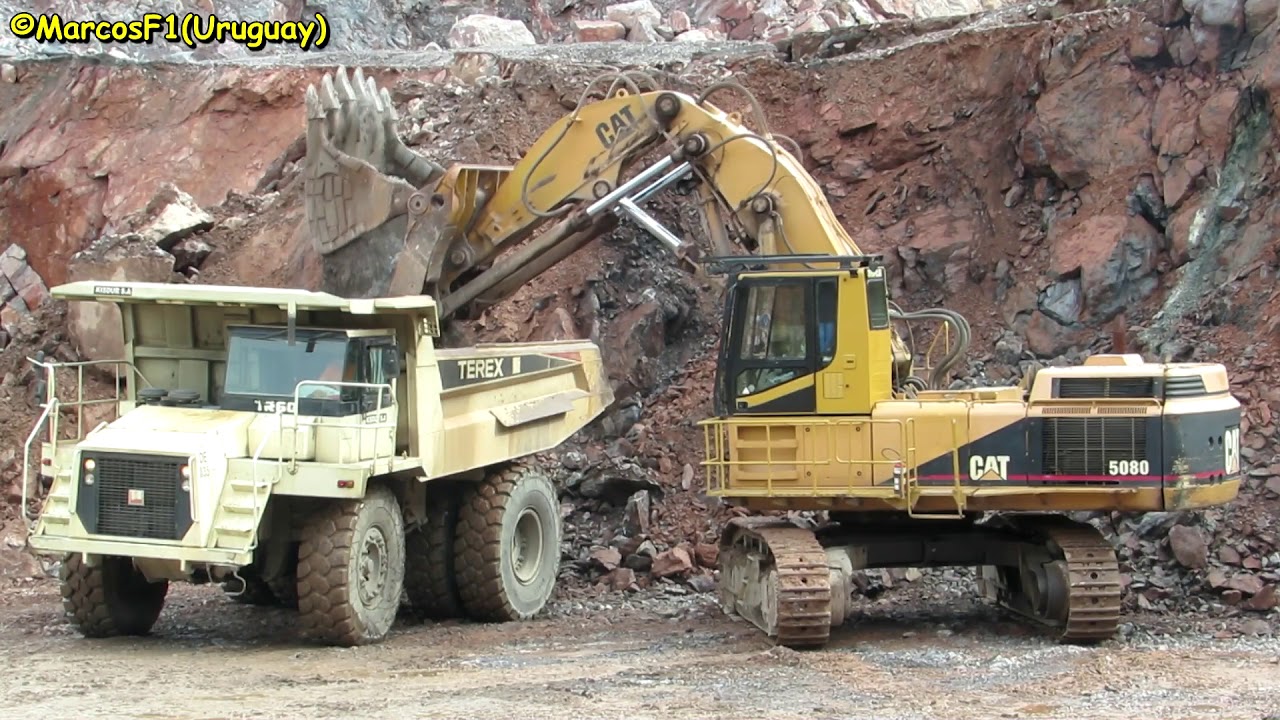 Caterpillar 5080 loading Terex-TR60