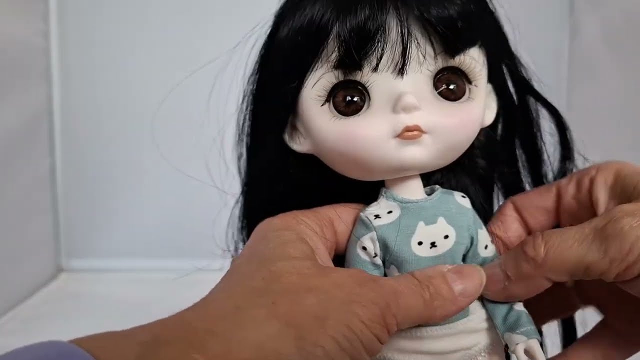 Trying fashions on Mori Lolli