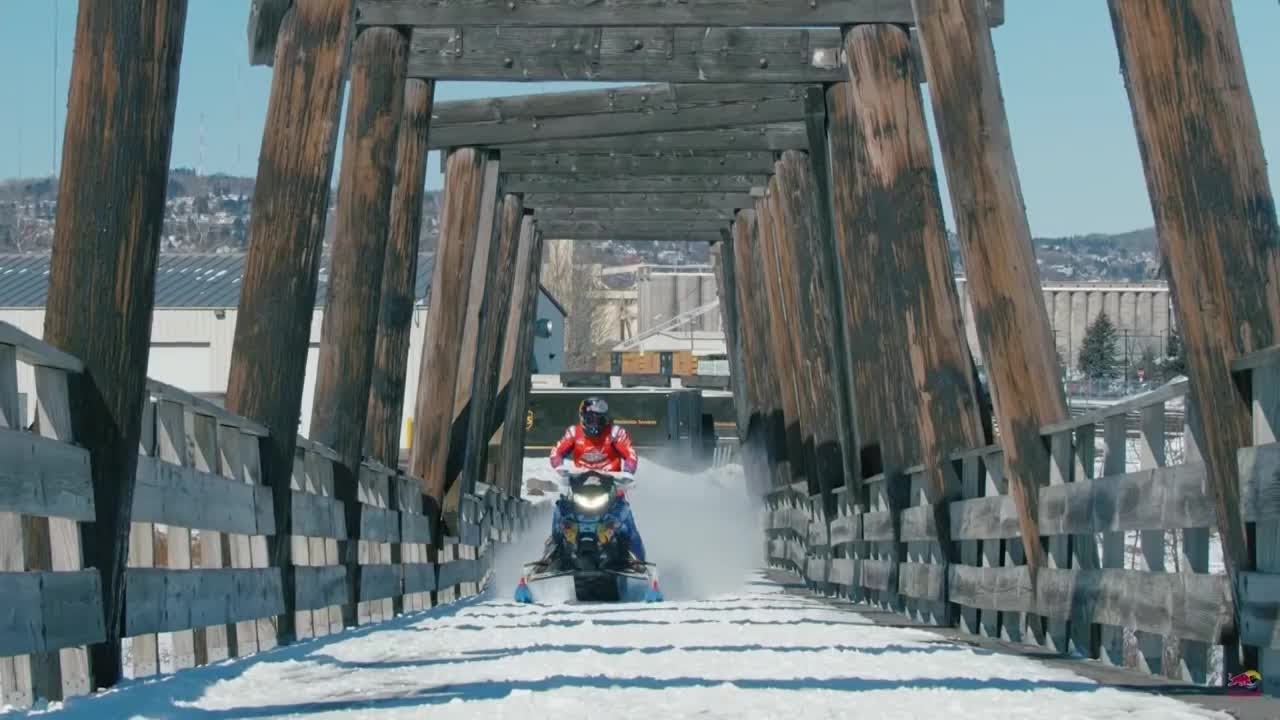 Stunt rider flips and flies through downtown Duluth on snowmobile