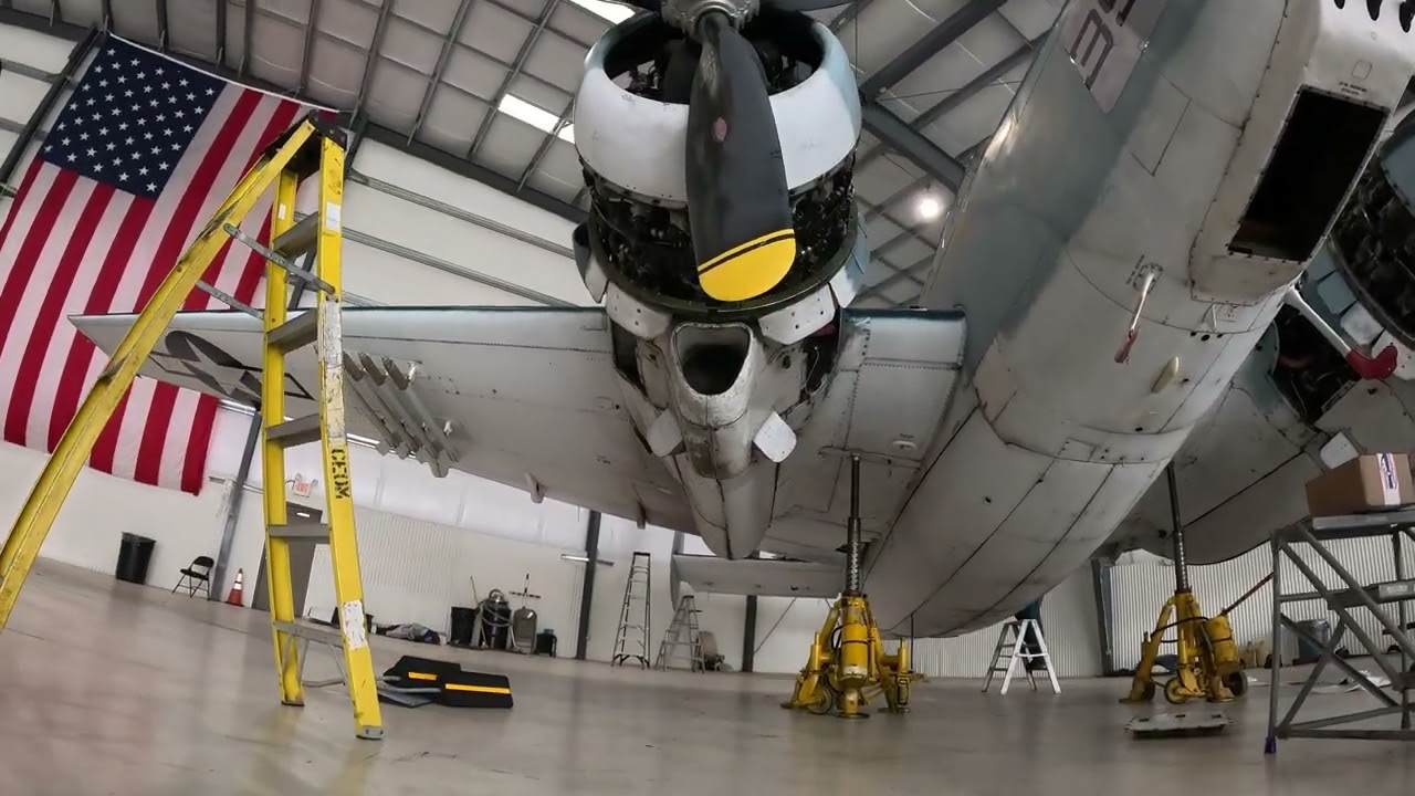 Circling the 'Island Doll' as it undergoes maintenance in a hangar