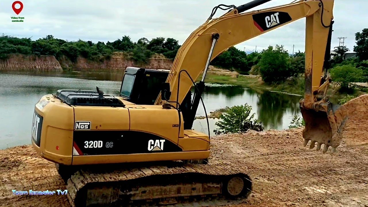 Excavator 320D digging intensely, transforming into a massive lake