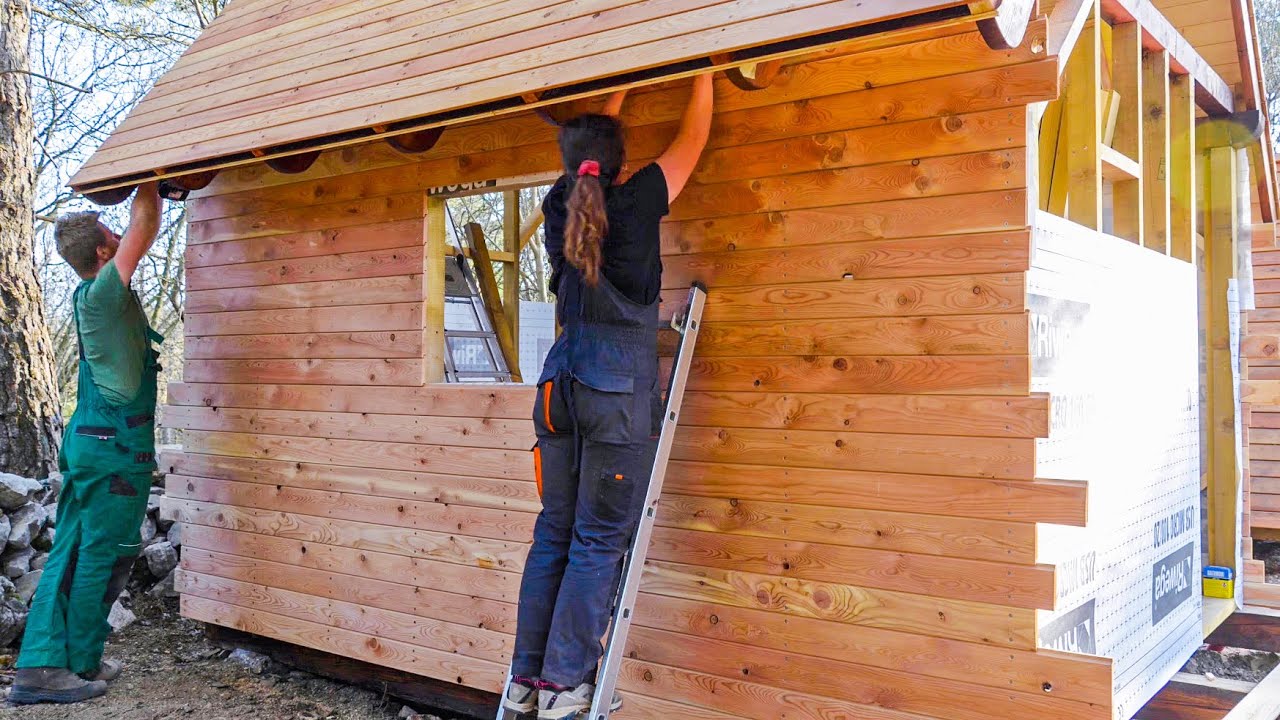 Building a Wooden CAMPING CABIN - Ep4: FINISHING THE EXTERIOR WALLS