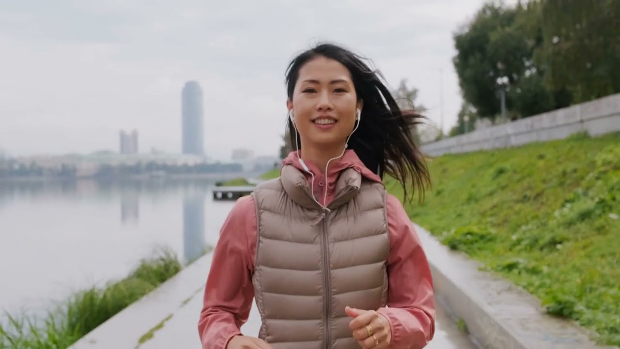 A Woman Wears A Smile While Jogging | Free Stock Video - No Copyright | 4K