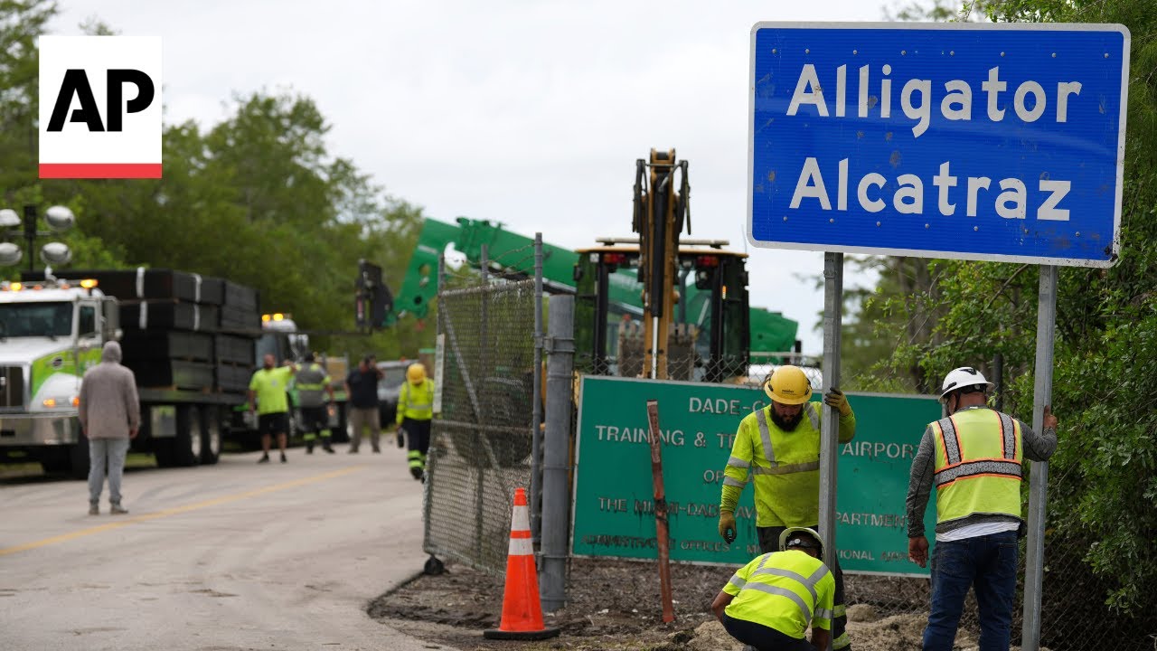 Workers install 'Alligator Alcatraz' sign for Florida immigration detention center