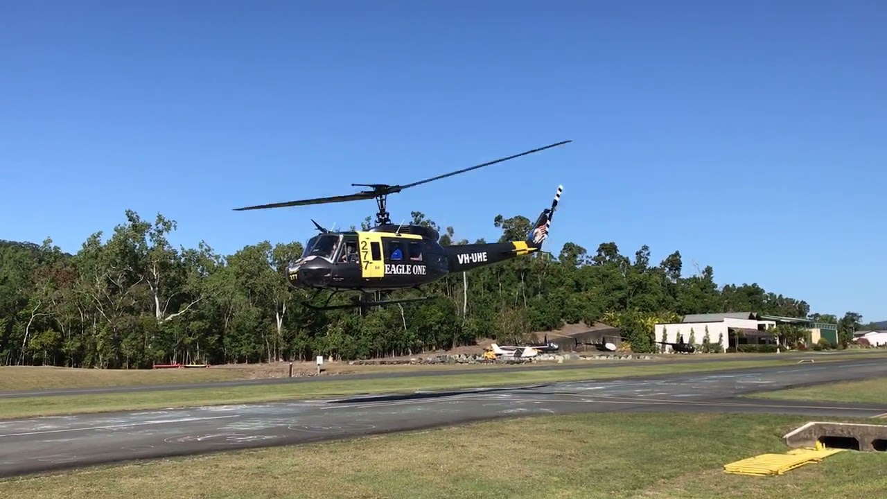 Helibiz Bell UH-1H Iroquois 'Huey' helicopter VH-UHE at the Whitsunday Airport at Shute Harbour