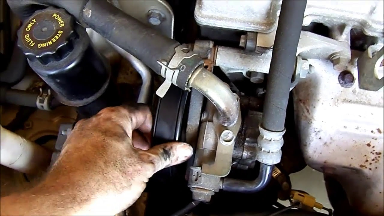1995 Mazda 626 Ford Probe Belt Change.  How to change or adjust the belt tension.