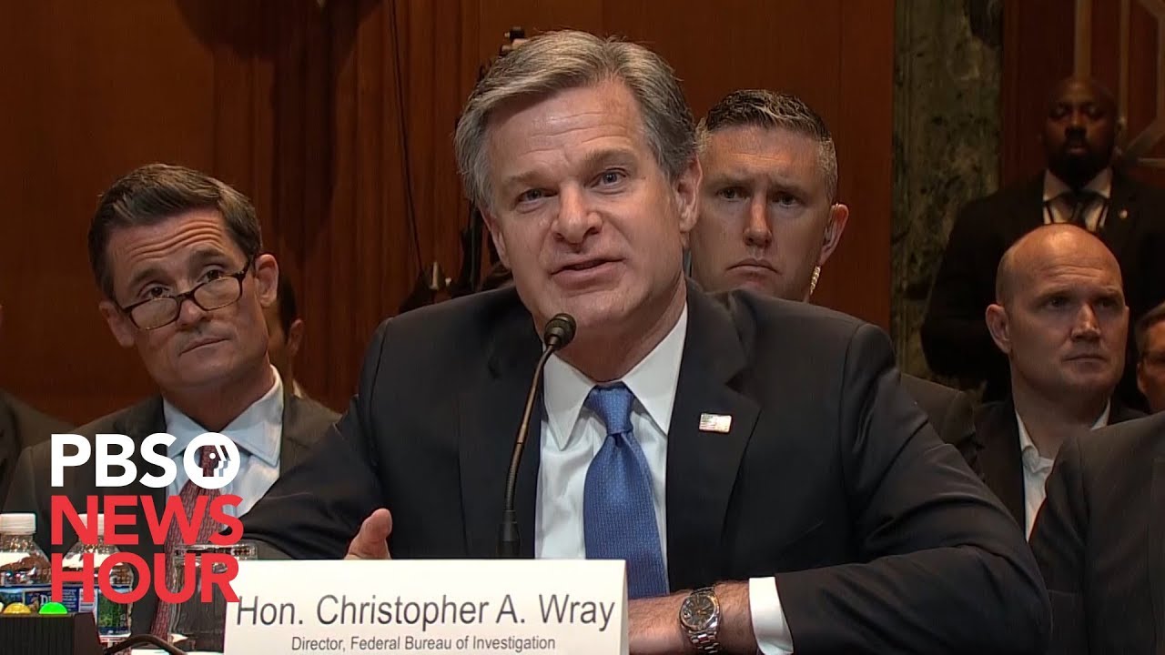 WATCH: FBI chief Wray breaks with Barr on use of term 'spying'