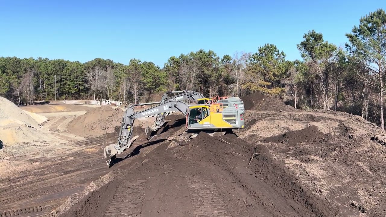 Two excavators cleaning up. 