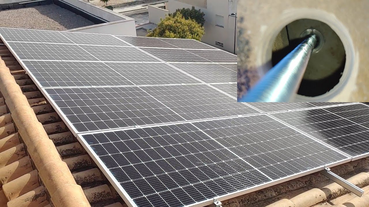 Instalación de paneles solares sobre tejado con estructuras coplanar