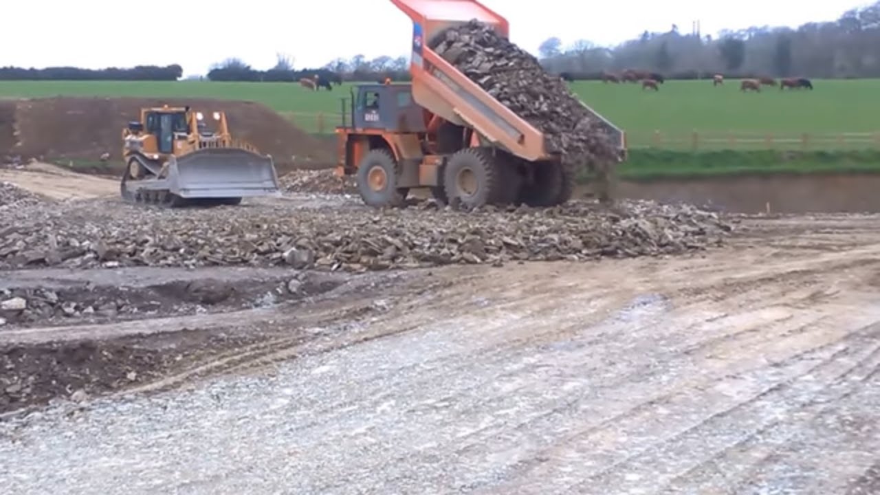 Cat D8 dozer at work pushing stone for road construction