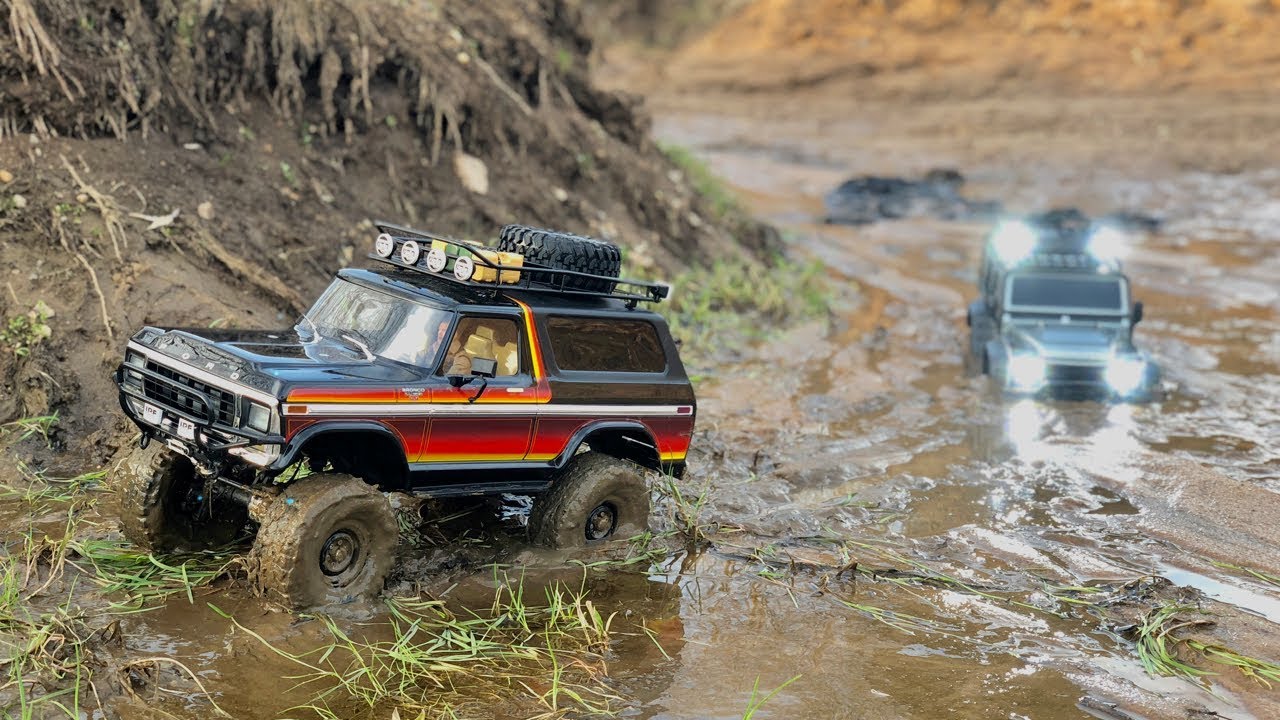 Traxxas TRX-4 Ford Bronco and Defender long muddy trail