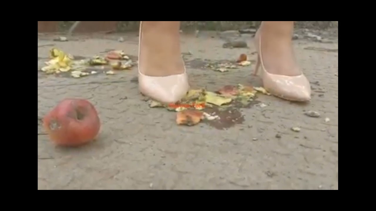 Crushing apples under my leather heels # goddess