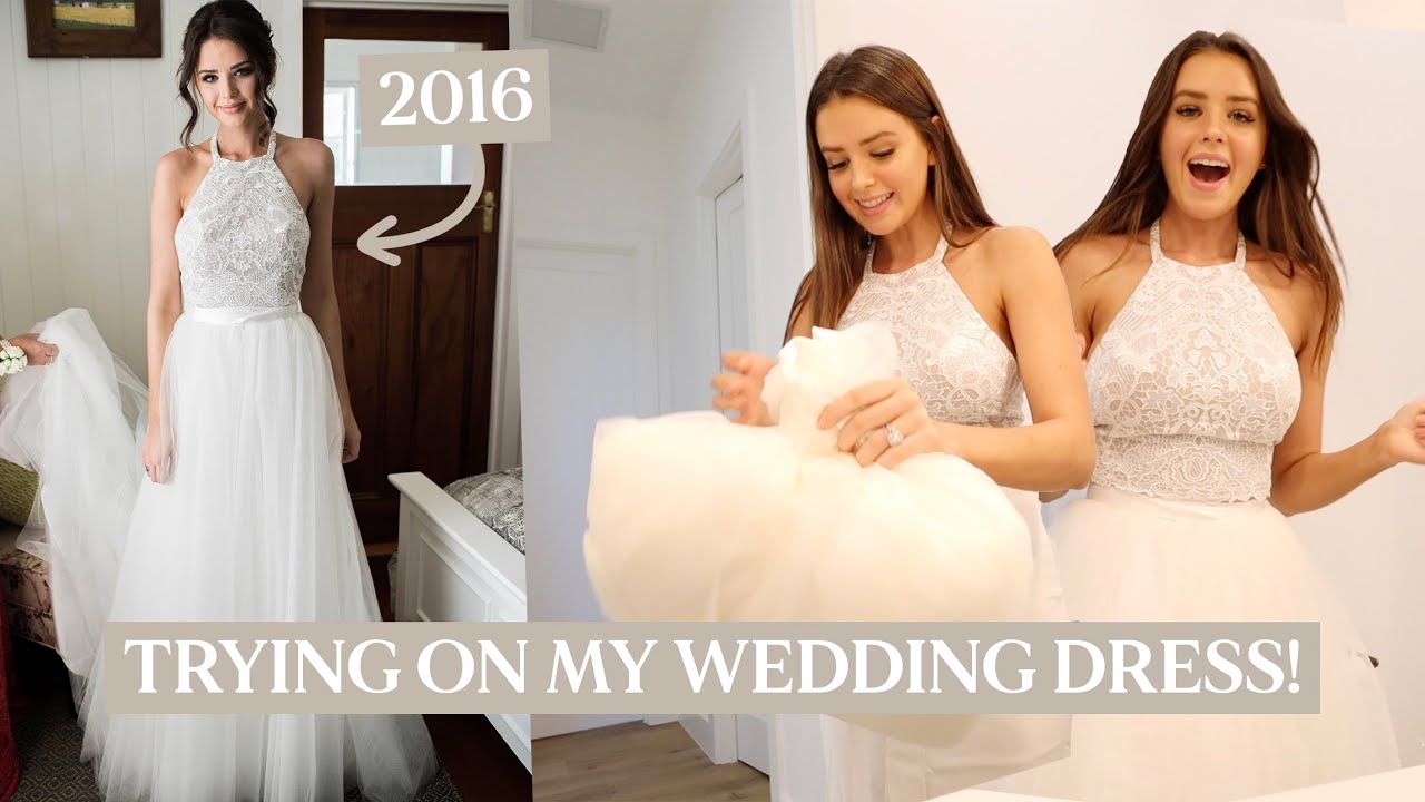 trying on my wedding dress 4 years later!!