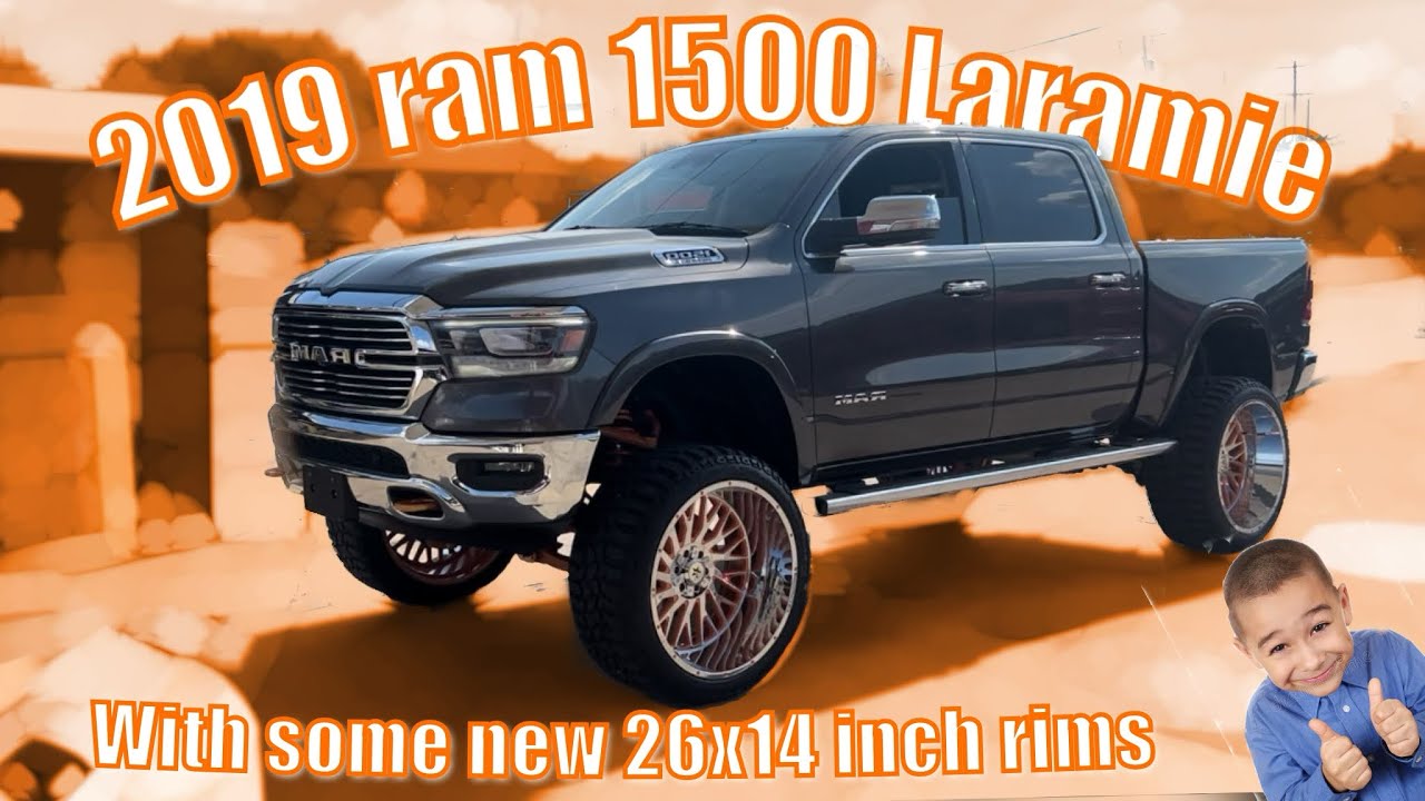2019 ram 1500 Laramie with a custom lift and 26x14 rims..