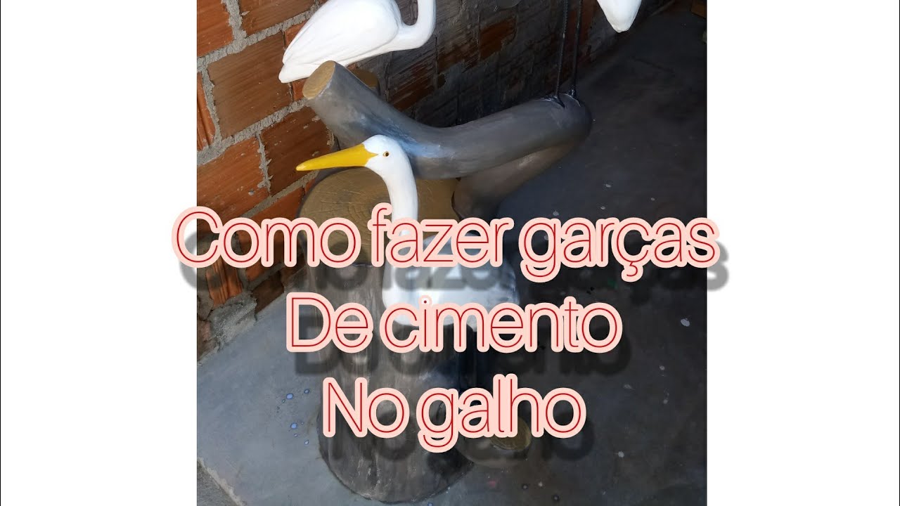 Garças de cimento no galho