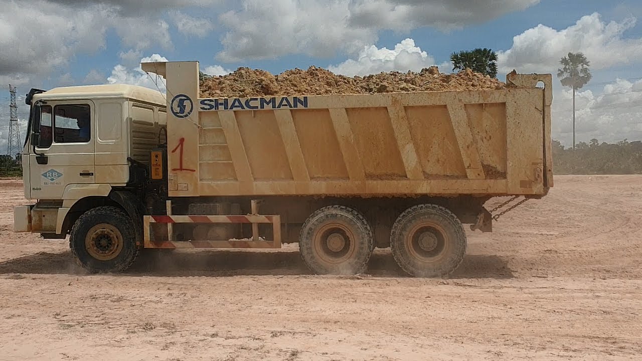 SHACMAN F2000 dump truck And Bulldozer SHANTUI SD22 at work