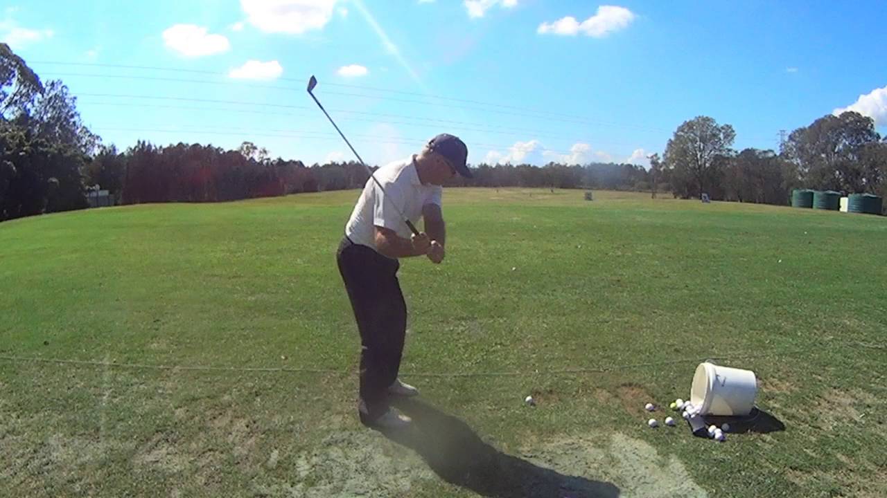 Chris Beckett golf swing from back view in slow motion