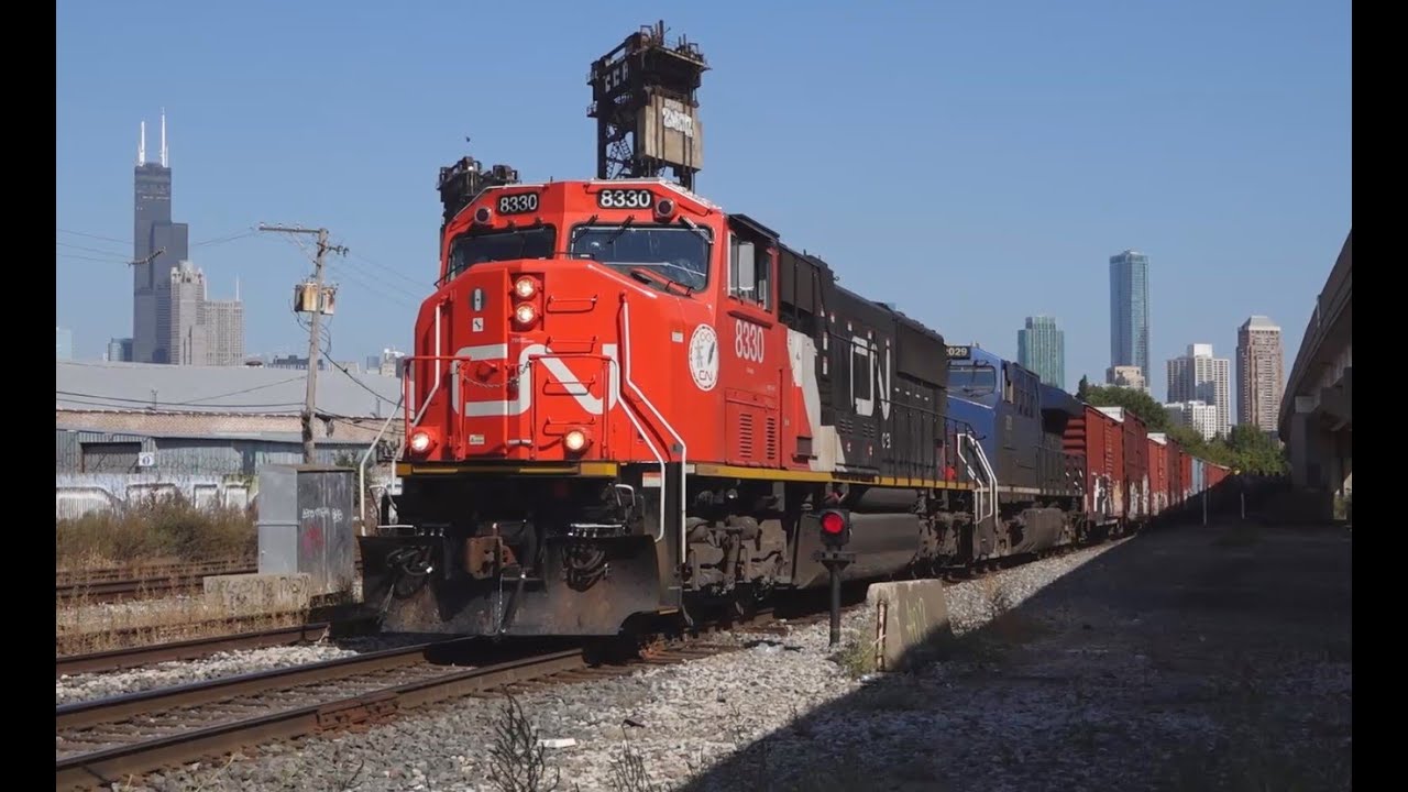 CN and Amtrak At 21st Street And Grain Extra At Ash St Crossing, Chicago, IL. 10-04-25