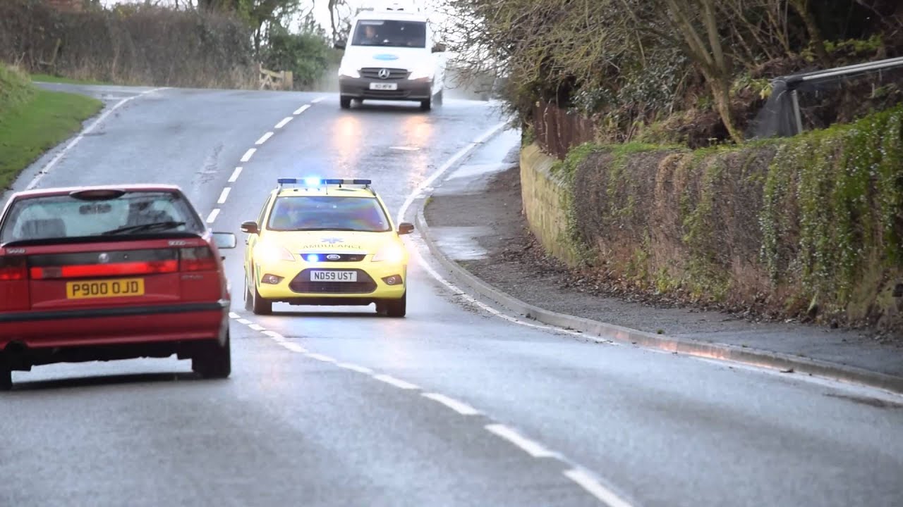 Ambulance - Rapid Response Vehicle NEAS Ford Focus Estate Responding to 999 Call