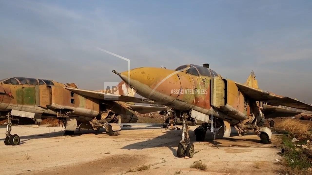Syrian insurgents in Aleppo International airport as they seize Syria's largest city of Aleppo