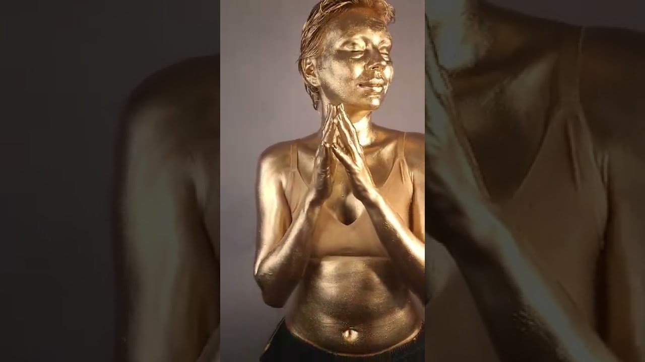 Painting With Very Shiny Gold Makeup