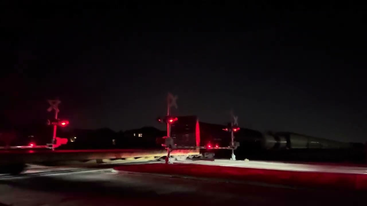 ￼ Train passing by railroad crossing ￼