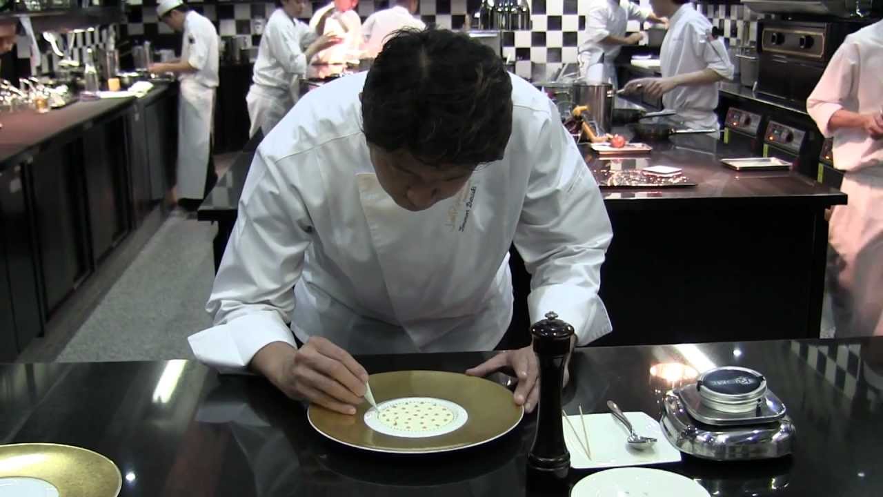 Danzaki prepares a signature dish at Joël Robuchon in Singapore