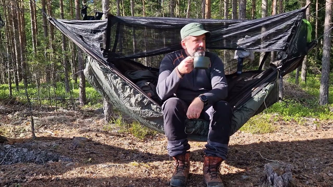 Hammock camping by a lake | Cranes