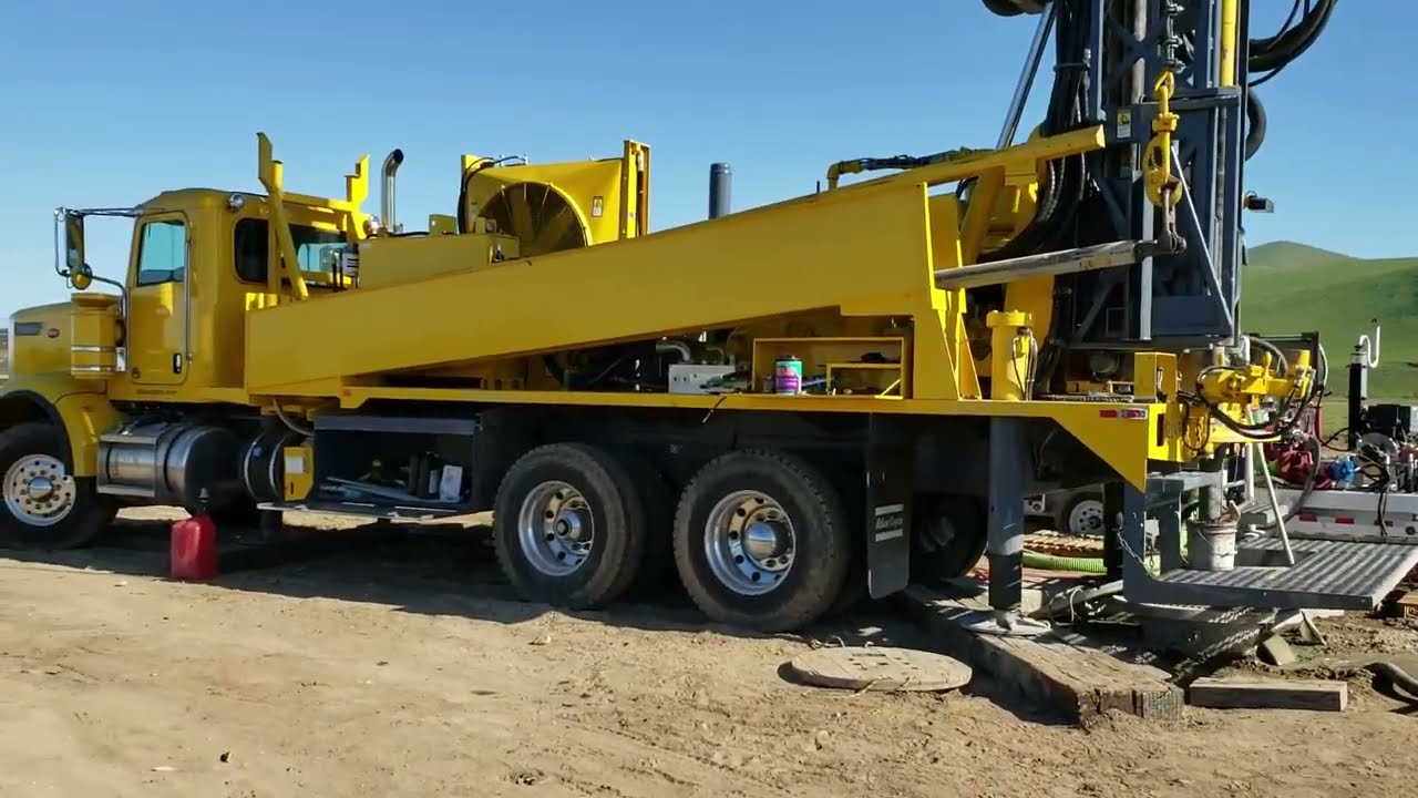 Water well drilling in alluvial riverbed formation with a TH-60 drill rig and a mud puppy screen.