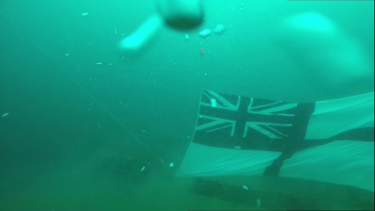 HMS ROYAL OAK Northern Diving Group, raising ensign & placing memorials.