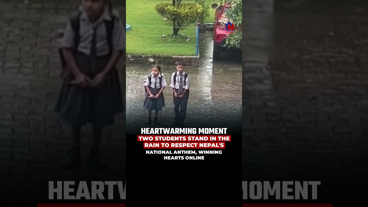 Two Students Stand in the Rain to Respect Nepal's National Anthem, Winning Hearts Online.