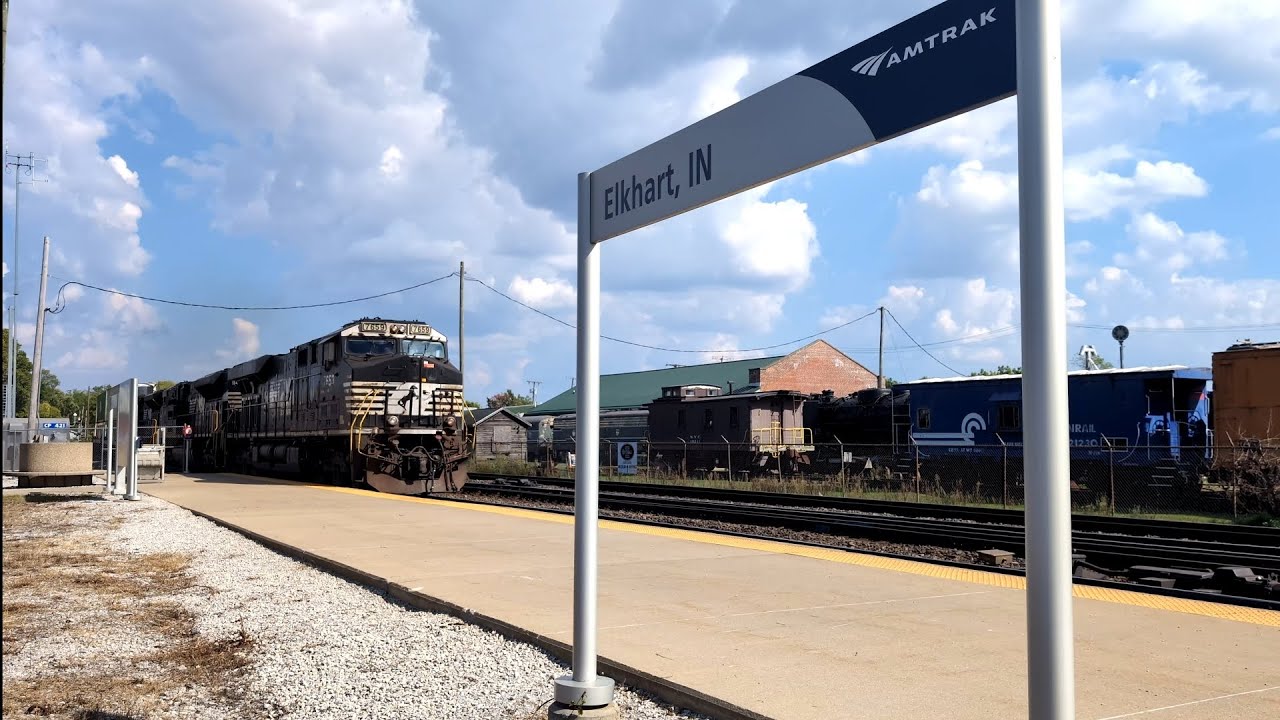 Triple Norfolk Southern Locomotives lead a double stack Intermodal train through Elkhart IN