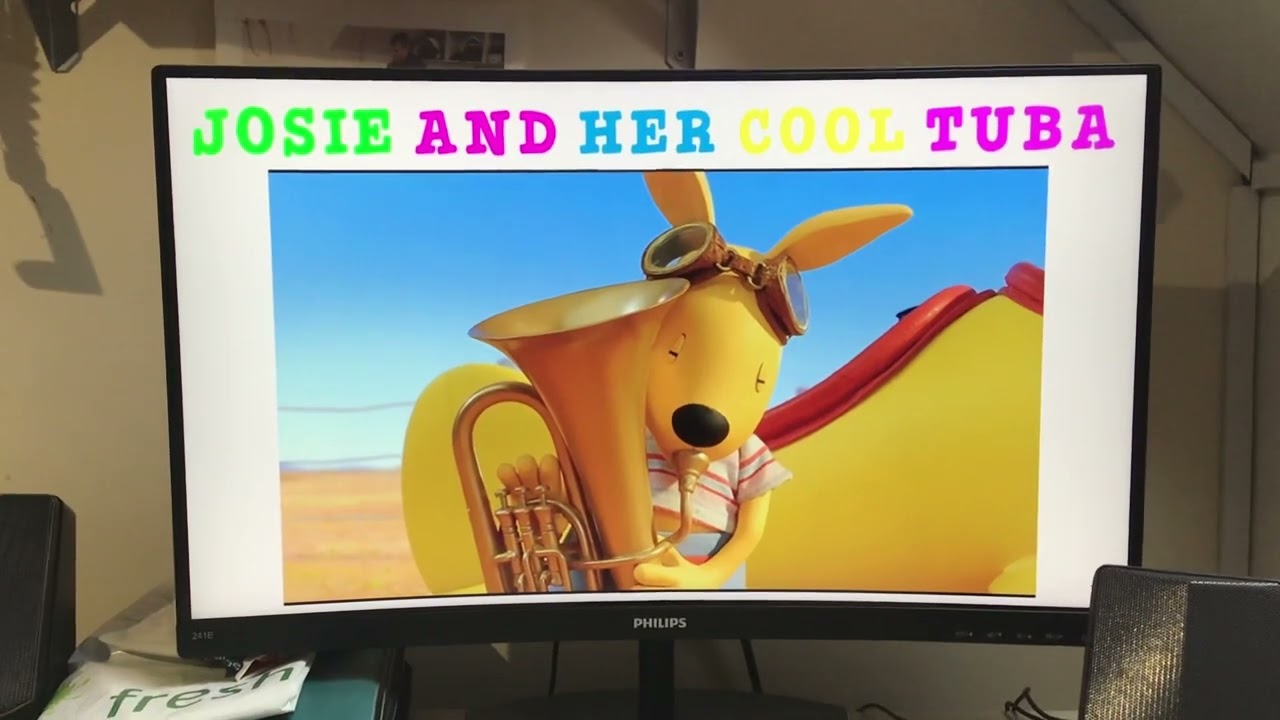 Josie and her cool tuba 💜💚💛