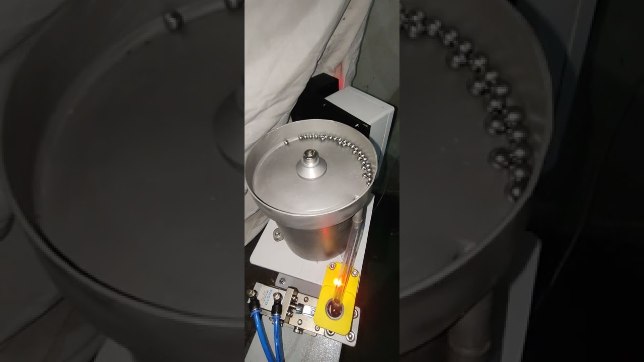 Ball feeding automation with escapement