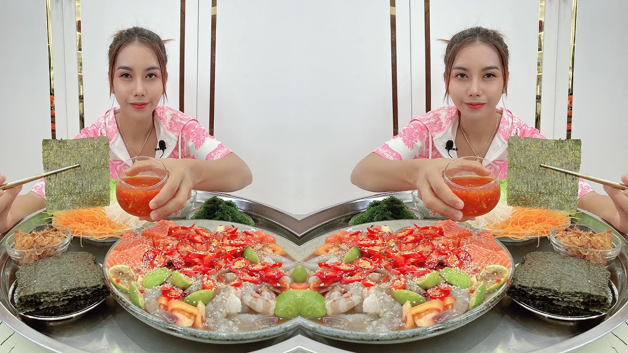 Eating salmon fish, raw shrimp with pra hok sauce