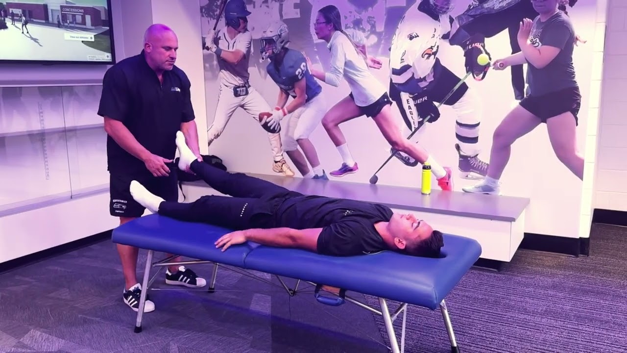 Chiropractor Adjusting  High School Football Player