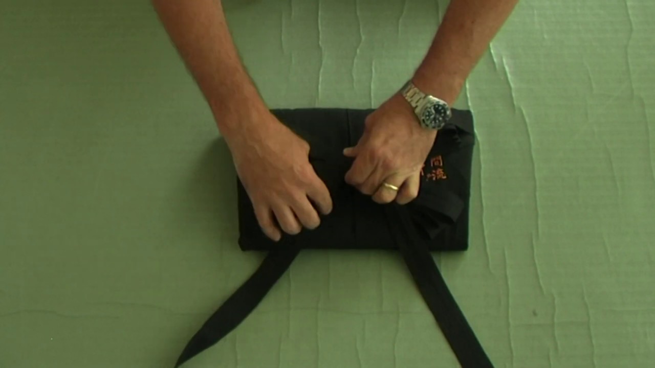 Folding a hakama with a musubi knot