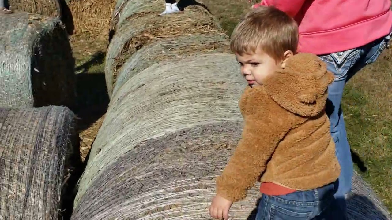 Lylah and mom roundbale jumping in Iowa